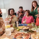 Supportive lunch group setting for men discussing eating disorder recovery in a safe environment