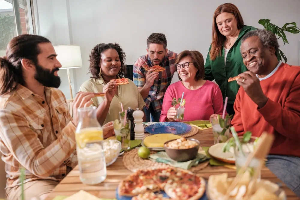 Supportive lunch group setting for men discussing eating disorder recovery in a safe environment