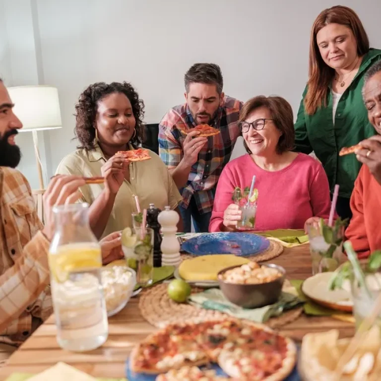Supportive lunch group setting for men discussing eating disorder recovery in a safe environment